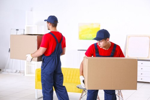 Man and van removals team loading furniture for a local move in Movers