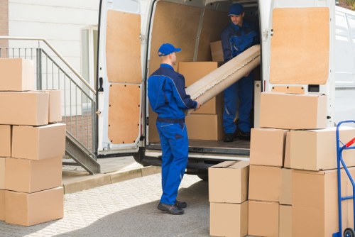 Office moving team preparing desks and boxes for a local business relocation