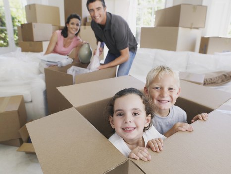 Professional movers handling office furniture in a commercial building