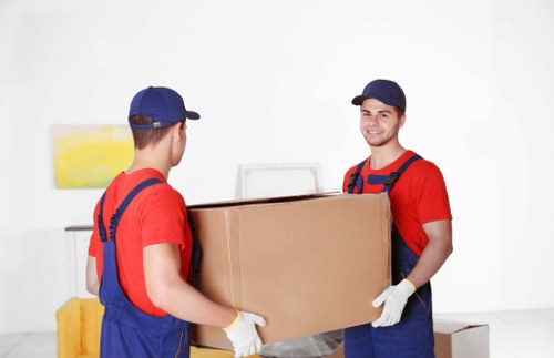 Local movers loading boxes for a residential move in Movers