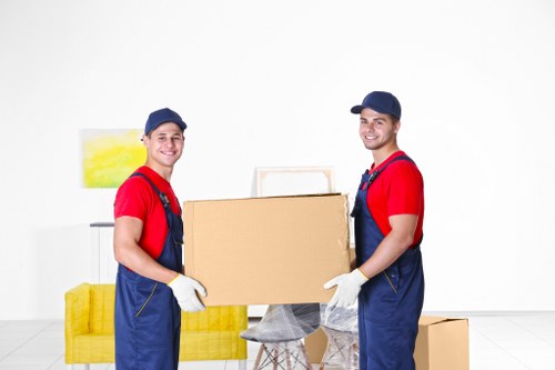 Packed moving boxes and furniture ready for transport during a house removal
