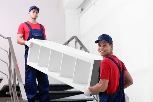 Movers Man And Van team sorting recyclable moving materials
