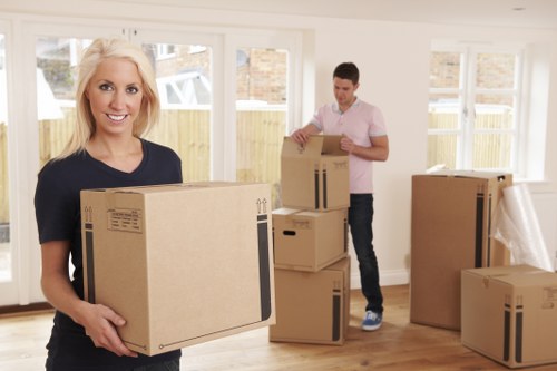 Furniture pick-up vehicle loading items for transport in Movers