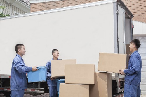Moving truck and movers preparing for a local residential move