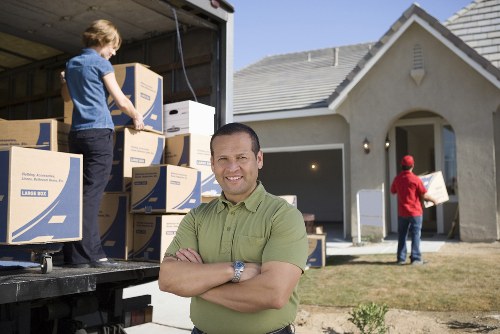 House removalists loading furniture for a local home move in Movers