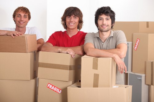 Local movers loading boxes and furniture for a residential move