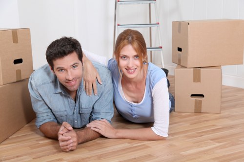 Moving team handling boxes and furniture for a local customer