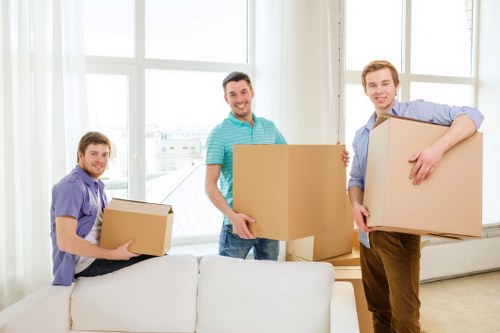 A professional mover carrying furniture during a man and van service
