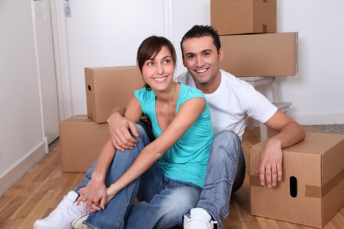 Trained removals staff handling boxes with care