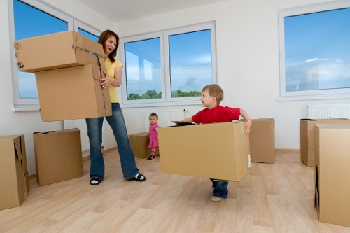 Movers handling office furniture and equipment with care