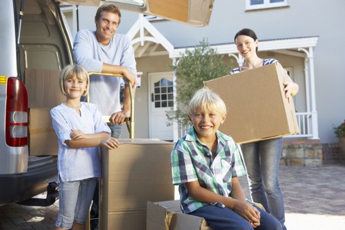 Professional moving service preparing furniture and boxes for transport