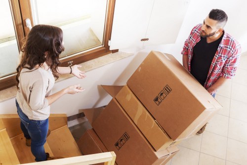 House moving team unloading boxes and furniture at a new residence