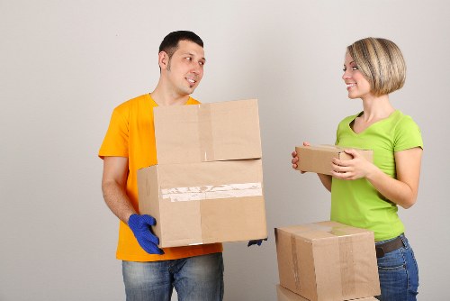 Boxes and furniture being loaded into a removals van