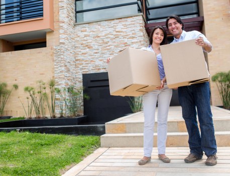 Mover handling a sofa carefully during a compact relocation job