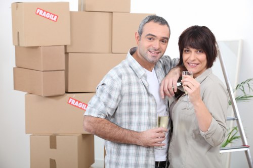 Professional movers organizing boxed belongings for a move